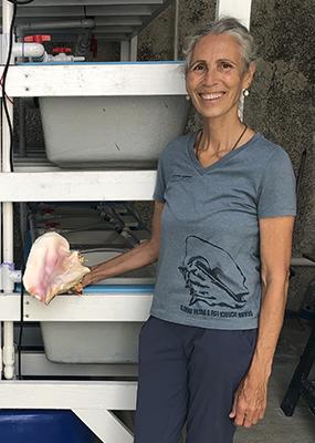 Megan Davis holding a conch shell